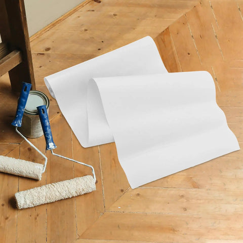 Self Adhesive Wallpaper For Kitchen Backsplash With Clear Removable Wall Protector Smooth Peel And Stick Application No Sweat Repositioning Durable Daily Protection Quick Fix Home Upgrade Shield on wood floor with paint tools.