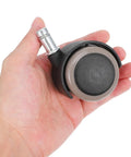 Grey Caster Wheel 10pcs Inch for Office Chair and Sofa held in hand, showcasing smooth plastic material and design.