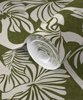 Top Notch Type II Professional Tropical Jungle Wallpaper Featuring Hella Durable Matte Finish and Subtle Linen Texture rolled out, heavy duty green design.