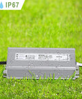 Heavy Duty 24V DC LED Driver 100W Power Supply Waterproof IP67 Transformer on grass with water droplets