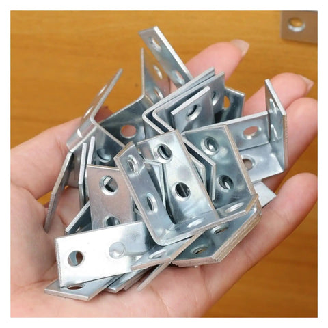 Hand holding multiple Beefy L Shaped Corner Brackets For Shelves Heavy Duty Metal Wall Mount Supports, steel construction, close-up view.