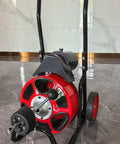 Heavy Duty Auto Feed Sewer Snake Auger With Fifty Foot Solid Steel Cable, red and metal design, used for drain cleaning.