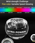 Gyro Ball Hand Exerciser With Counter And Auto Start Gyro, Wrist And Forearm Strengthener For Quick Arm Workouts, LED Lights And Colorful Display, Portable Grip Trainer For Strength, Endurance, And Real Fast Gains. Black gyro ball with rainbow speed chart and carrying bag.