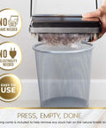 Electrostatic Carpet And Floor Sweeper Boasts A Nine Inch Cleaning Path For Tile And Rug, emptying debris into a gray mesh trash can.