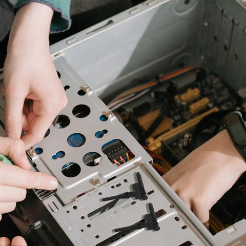 Installing Thirty Piece Black Silicone Cooling Fan Mounting Screws For Pc Computer Case with rubber sleeves in a desktop.