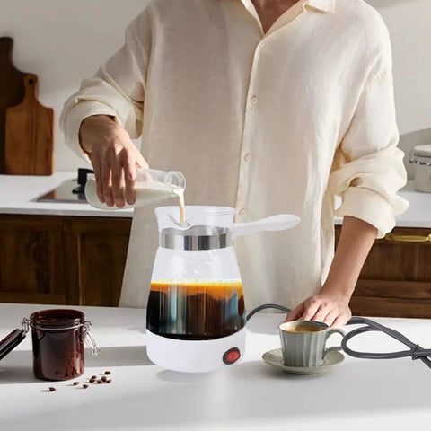 Electric Turkish Coffee Pot 600ML Quick Heat Coffee Maker With Glass Carafe 600W For Turkish Coffee And Tea US Plug Yellow Finish Brew Like A Boss At Home, shown on a kitchen counter being used to brew coffee.