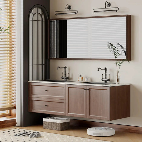 Modern bathroom with wooden cabinet, dual sinks, large mirror, black fixtures, and decorative plant accents.