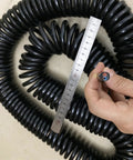 Heavy Duty Retractable Twin Spiral Extension Cord With Four 2.5 Mm Conductors Stretching Up To Ten Meters Quick Roll Up in coiled form.