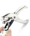Three Pack Single Hole Punch Pliers Set With 10 Sheet Capacity, Silver Finish shown punching paper confetti