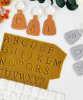 Dope 26 Piece Alphabet Polymer Clay Cutters Set Uppercase Letters with leather and fondant keychain craft examples