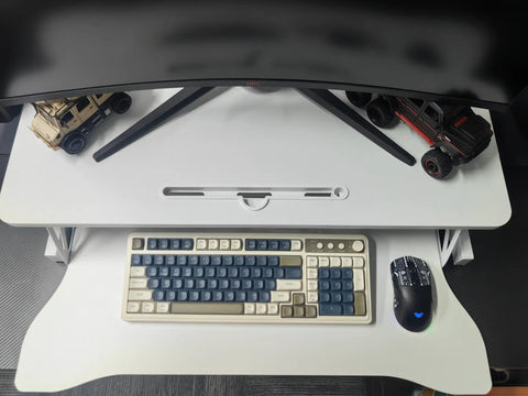 Top view of 32 Inch Height Adjustable Standing Desk Riser For Home Office And Gaming, with keyboard and mouse on the white platform.