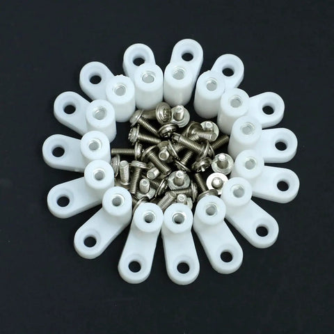 Eighty PCS L Shape Plastic Motherboard Standoffs With Eighty Matching Screws For PC Circuit Boards And Gaming Rigs on a dark background.