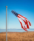 All American 60 Inch Windsock For Outdoor Decor, Heavy Duty 210D Nylon Windsock With Embroidered Stars on flagpole in field