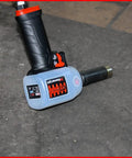 Pro Shop Essential 1/2 Drive Pneumatic Impact Wrench displaying ergonomic handle and robust design on a workshop floor.