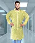Person wearing Yellow Disposable Lab Coats For Adults XL, 50 Pack, Knee Length, No Pockets, Elastic Wrists, Hook And Loop Closure