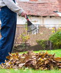 Using Two Piece Plastic Garden Pitchfork Rake Set With Leaf Grabber Claws for lawn cleanup, handheld tool in action