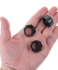 Hand holding three Six Pack 17mm Ball Head Tightening Nuts for Car Mounts, screw-on replacement parts, black ABS material.