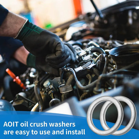 Mechanic installing Heavy Duty M18 Aluminum Oil Drain Plug Gasket Crush Washers Kit on Volvo engine