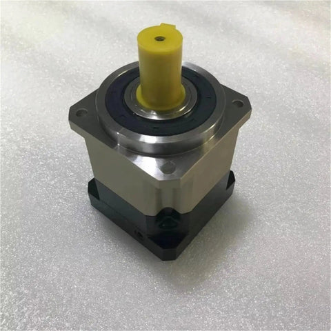 High Performance Hard Tooth Planetary Gear Reducer Delivering Rock Solid Torque Conversion And Absolute Zero Slop Action For Heavy Duty Speed Reduction Projects, featuring a metallic housing and yellow output shaft.