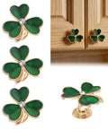 Gold Clover Drawer Knobs 4 Pack For Wardrobe Cabinets Dresser Cupboard Modern Minimalist Pulls Zinc Alloy With Crystal Center Green Enamel Accents Easy Replacement Handles in packaging and on wood cabinet.