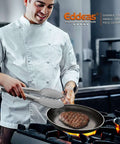 Chef using Heavy Duty Stainless Steel Kitchen Tongs Set Of 3 7 Inch 9 Inch And 12 Inch Heat Resistant To 600 Degrees on stovetop
