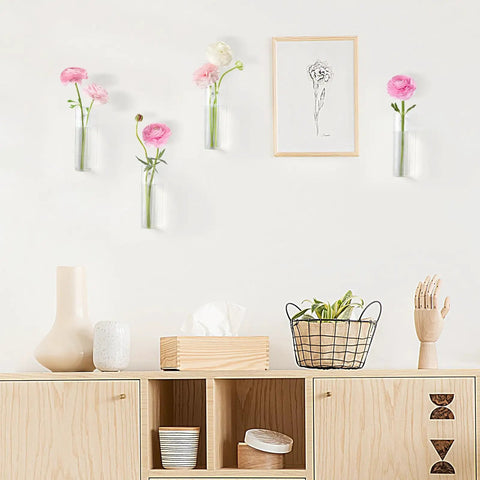 Glass Tube Propagation Station Hanging Vase Set - 4 Cylinder Wall Planters on white wall with flowers, decor below.