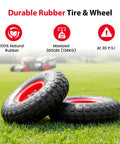 Two 4.10/3.50-4 Tire And Wheel Set, 10 Inch Air Filled Wheels With 5/8 Inch Axle Bore resting on grass, red rim visible