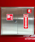 12 Pack Fire Extinguisher Arrow Down Decals 4x12 Inches Self Adhesive Weatherproof Vinyl displayed on metal cabinet door