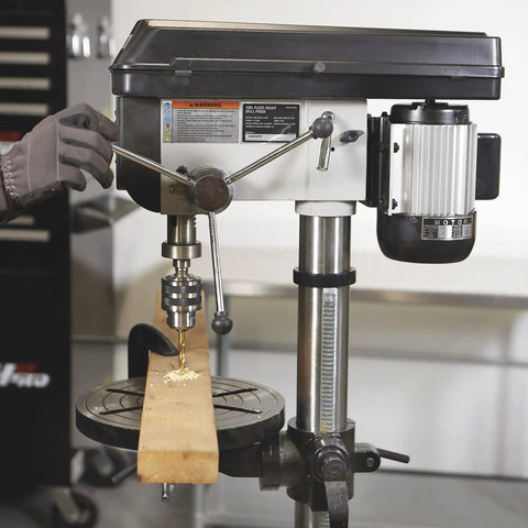 Workhorse Floor Drill Press With Sixteen Speeds, Thirteen Inch Swing, Three Quarter HP, 120V in use on wooden board