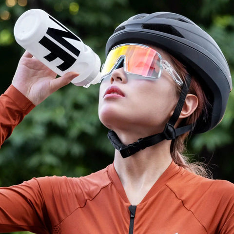 Cyclist drinking from Leak Resistant Squeeze Lid Water Bottle For Biking And Hiking, Lightweight Sports Bottle with Wide Mouth