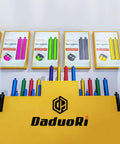 Front view of a DaduoRi drill bit display: yellow counter with logo and framed drill-bit posters, plus colorful cylinders.