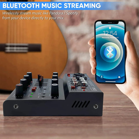 Side view of 4 Channel Wireless DJ Mixer With Bluetooth 5.x USB Audio Interface, paired with smartphone showing Bluetooth icon.