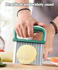 Crinkle cutter with green plastic handle and stainless steel ridged blade for making crinkle-cut potato fries.