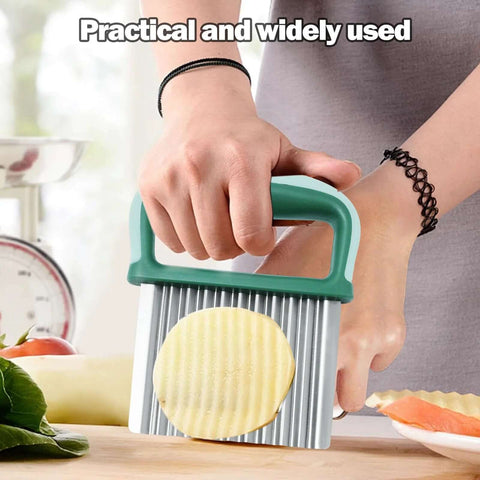 Crinkle cutter with green plastic handle and stainless steel ridged blade for making crinkle-cut potato fries.