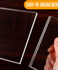 Clear Acrylic Couch Wall Spacer And Bed Blocker Stops Furniture Scrapes Keeps Heaters Cool Preserves Outlet Access Built Tough No Sweat Setup Invisible Wall Guard Anti Scratch Two Pack shown in hand close-up.
