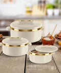 Stainless Steel Casserole Set Featuring Zero Sweat Double Wall Heat Lock To Keep Your Roti Gravy And Batch Cooked Meals Fresh Hot All Day Long Pro Grade Kitchen Storage Containers Set Of Three Ivory display on wooden countertop with golden accents.