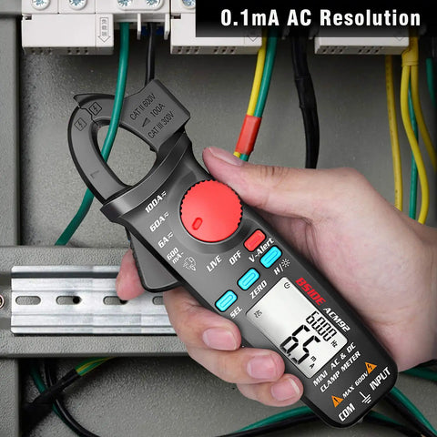Person testing electrical wires with DC Current Clamp Meter 6000 Counts Digital Multimeter Amp Continuity Ohm Hz Live Check V Alert Voltage Tester