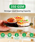 Hand holding Deer Hunting Party Tableware Set For Men And Women, 250 Pieces Camouflage Forest Theme Serves 50 Guests plate with food