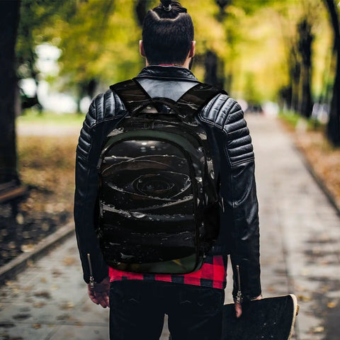 Man wearing the Dew Rose Print Unisex Backpack With Large Capacity For Everyday Carry, durable polyester, in a park setting