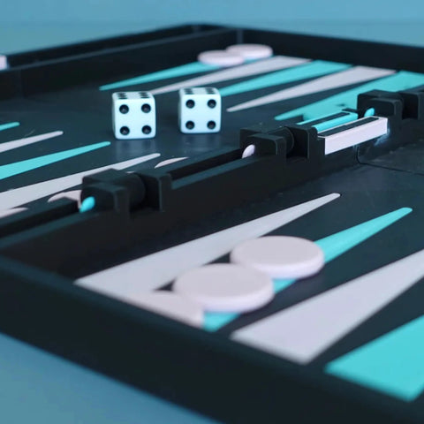 Polymaker Panchroma Matte PLA filament, charcoal black, 1.75mm, 1kg spool, shown beside a game board with dice