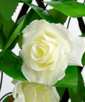 Close-up of white flowers on the Expandable Faux Ivy Fence Screen for Balcony and Patio 16x45 Inch Closed Expands to 92 Inch Wide Willow Frame