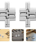 Concealed Hinge Set 43mm For Cabinet Doors 4 Pack Zinc Alloy Cross Hidden Hinges displayed on a workbench, ideal for DIY projects.
