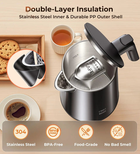 Top view of a Fast Boil Electric Kettle 1.0L 1200W with open lid, stainless steel finish, on a wooden surface with coffee and cookies.
