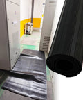 Built Tough Hardcore Commercial Grade Rubber Safety Mat For High Voltage Electric Shock Defense and Solid Grip Shop Shielding Oil Proof Anti Slip Cushion For Switchgear Setup Areas on floor next to electrical panel.