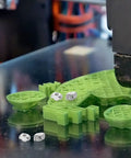 Kick 3D Printing Up A Notch With These 40 Hammer Head M3 Carbon Steel T Slot Nuts near green 3D printed parts on metal surface.