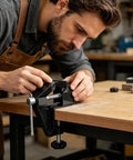 Cool Mini Table Vise With Adjustable Clamp Jaw For Secure Carving Woodworking And Detail Assembly Projects At Home Or Work, close-up on a workbench.