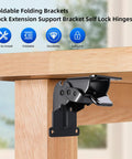 Heavy Duty Folding Brackets 4 Pack With Screws, Self Locking Steel Hinges For Table Legs Bed Frames And Workbenches, Rock Solid Legit Job Site Support Brackets In Black mounted on a wooden table leg.