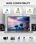 Desktop USB Powered 2.0 Computer Speakers With Volume Control And RGB LED Lights next to a laptop, compatible with PC, Mac, Linux.