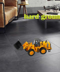 Large Wheeled Loader Heavy Duty Construction Metal Bulldozer Toy For Kids on indoor floor next to couch and table