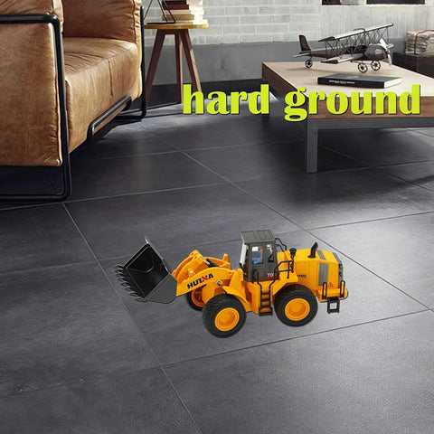 Large Wheeled Loader Heavy Duty Construction Metal Bulldozer Toy For Kids on indoor floor next to couch and table